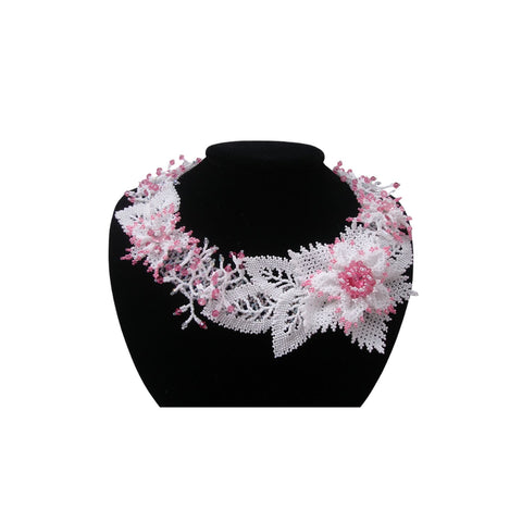 Handmade beaded floral necklace with intricate white and pink beadwork, featuring a lace-inspired design and a statement flower centerpiece, perfect for weddings and formal occasions