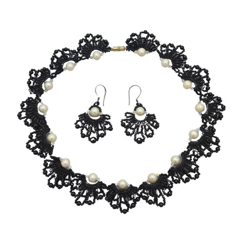 Handmade black beaded necklace and earrings set with white pearls in an elegant lace-inspired fan design, perfect for special occasions or as a unique gift.