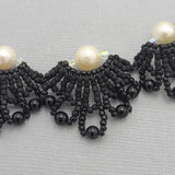 Handmade black beaded necklace and earrings set.