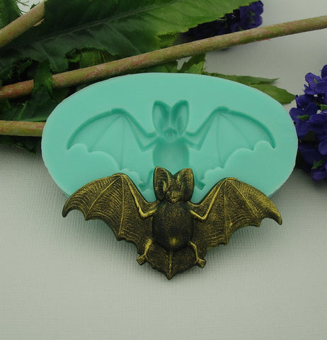 A flexible silicone mold featuring a detailed bat design, perfect for creating resin jewelry, polymer clay figurines, and DIY Halloween crafts