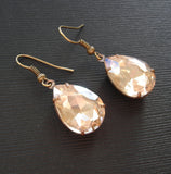 Gold Peach Swarovski Teardrop In Antiqued Brass Prong Settings.