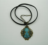 Turquoise Lucite Oval Cabochon Filigree Wrapped Suede Cord Necklace.