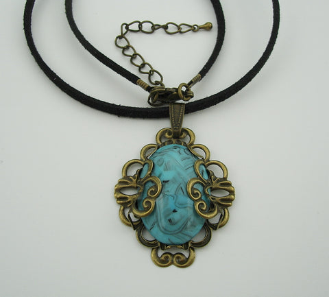 Turquoise Lucite Oval Cabochon Filigree Wrapped Suede Cord Necklace.
